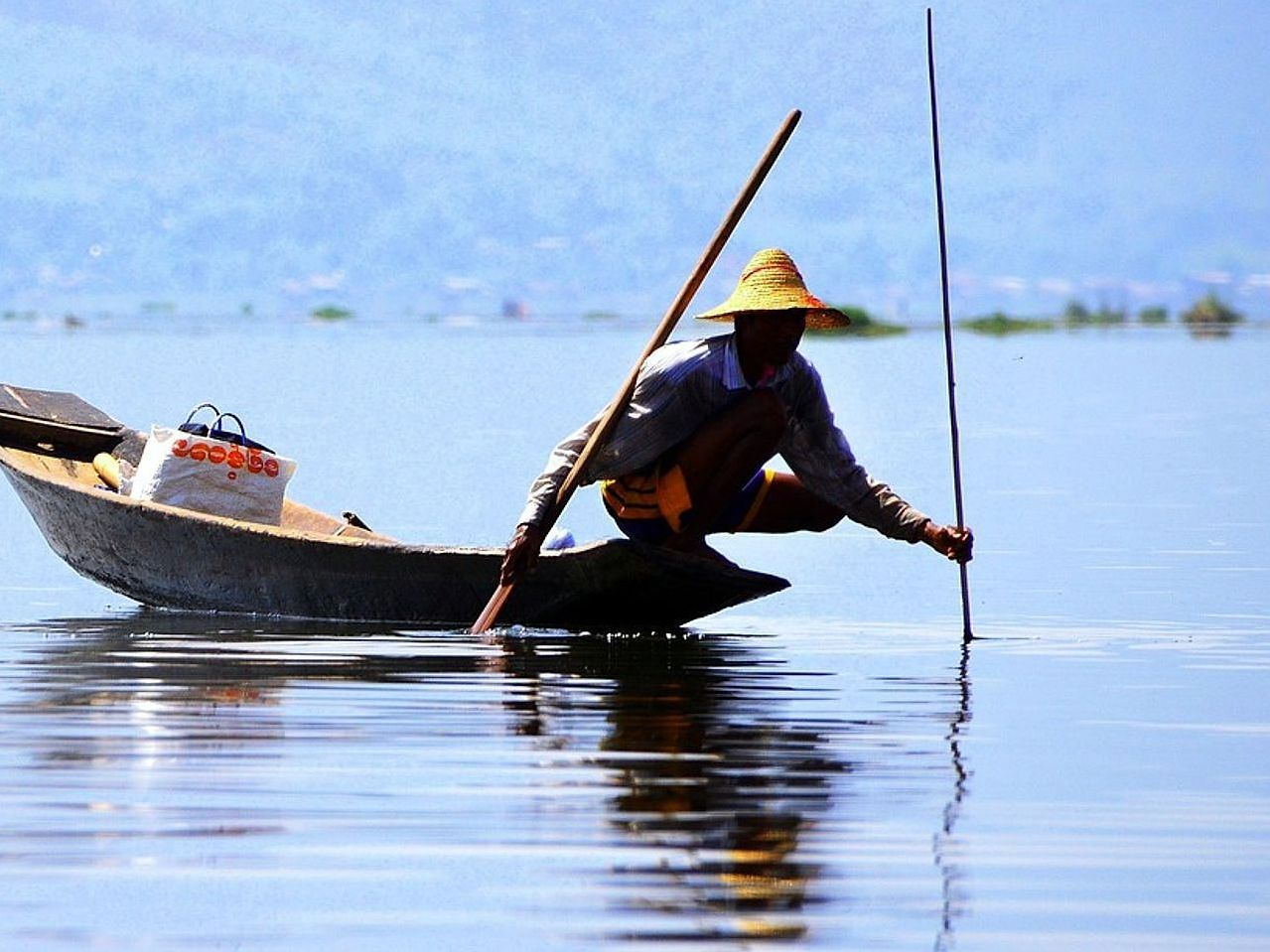 Pescador na água